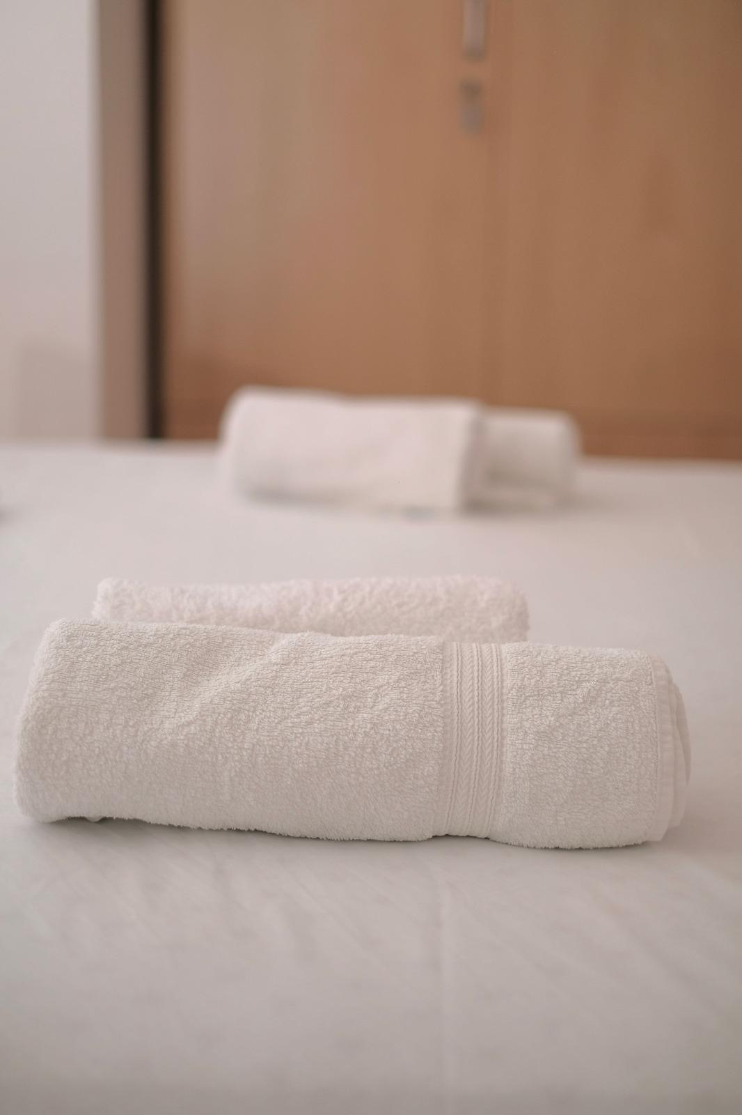 Fresh white towels prepared for arriving guests